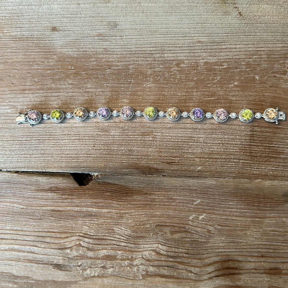 8” assorted Crystal bracelet. Beautiful color crystal stones and safety clasp